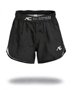 ALL CORNERS Women's Shorts in black, front view on an invisible mannequin — branded ADAPT • EVOLVE • PERFORM waistband strap and white AC mark
