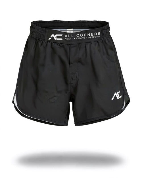 ALL CORNERS Women's Shorts in black, front view on an invisible mannequin — branded ADAPT • EVOLVE • PERFORM waistband strap and white AC mark